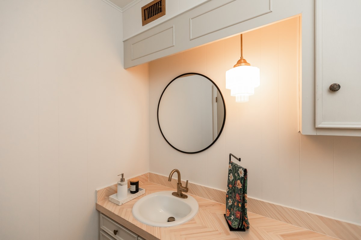 1210 Nottingham Lane Beaumont, TX 77706 - Photo 15 of 50 a bathroom with a sink and a mirror