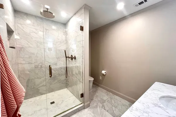 a bathroom with a double vanity sink mirror and double