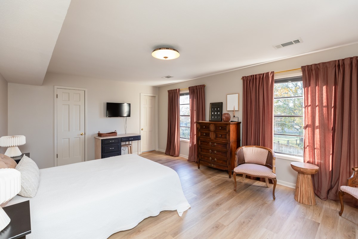 1210 Nottingham Lane Beaumont, TX 77706 - Photo 33 of 50 a bedroom with a bed and wooden floor