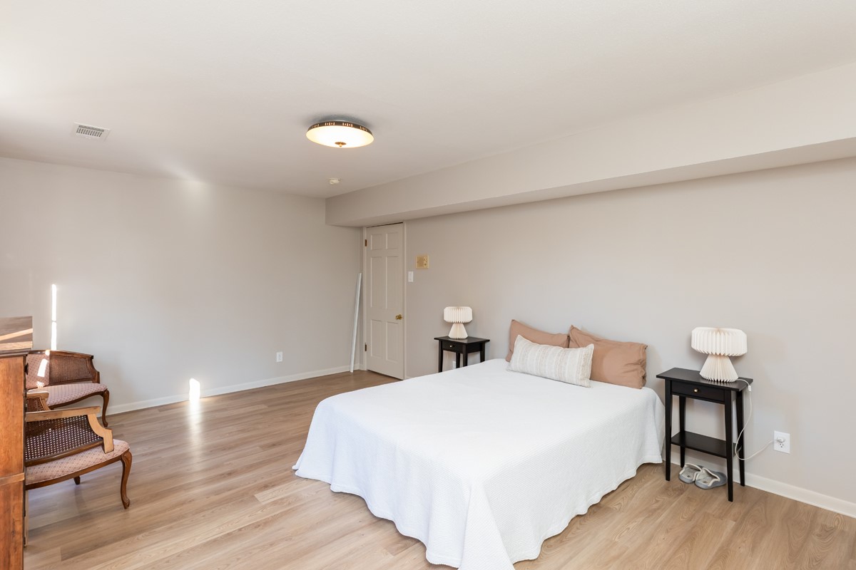 1210 Nottingham Lane Beaumont, TX 77706 - Photo 34 of 50 a bedroom with a bed and a chair