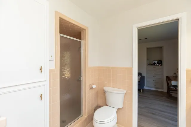 a bedroom with furniture and a wooden floor
