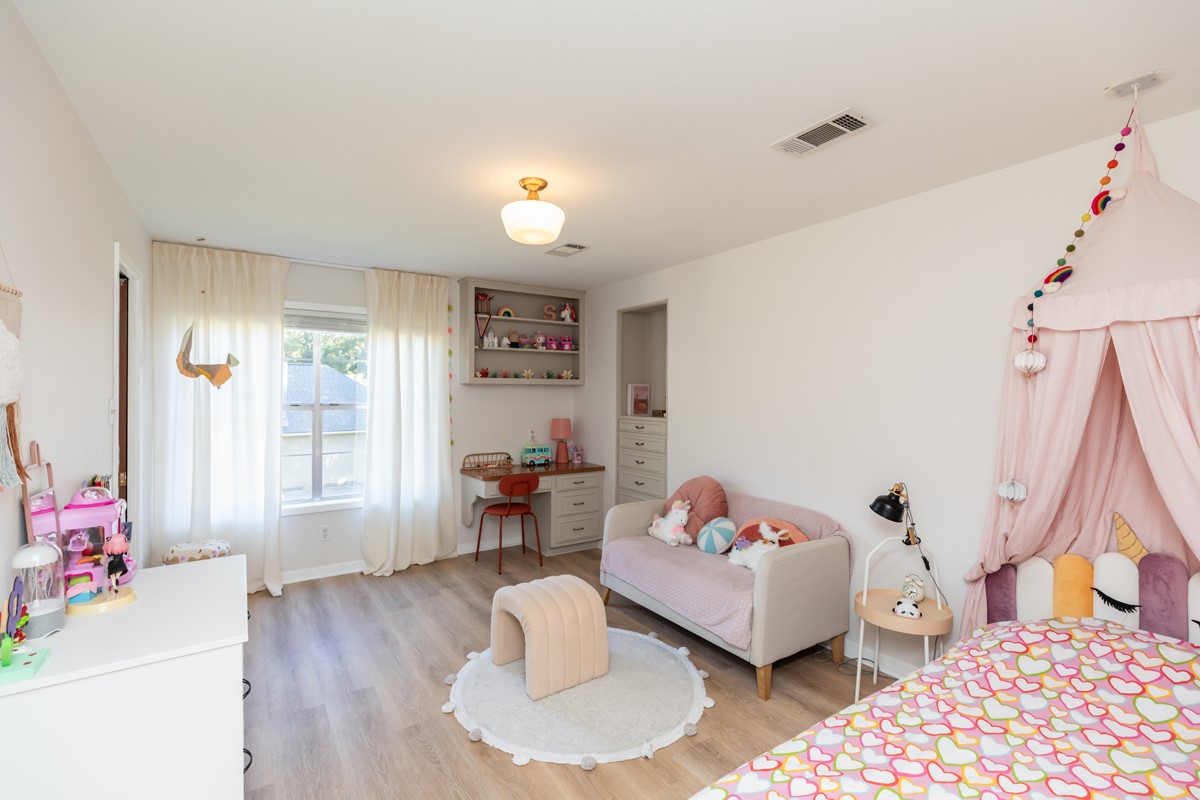 1210 Nottingham Lane Beaumont, TX 77706 - Photo 40 of 50 a bedroom with furniture and a wooden floor