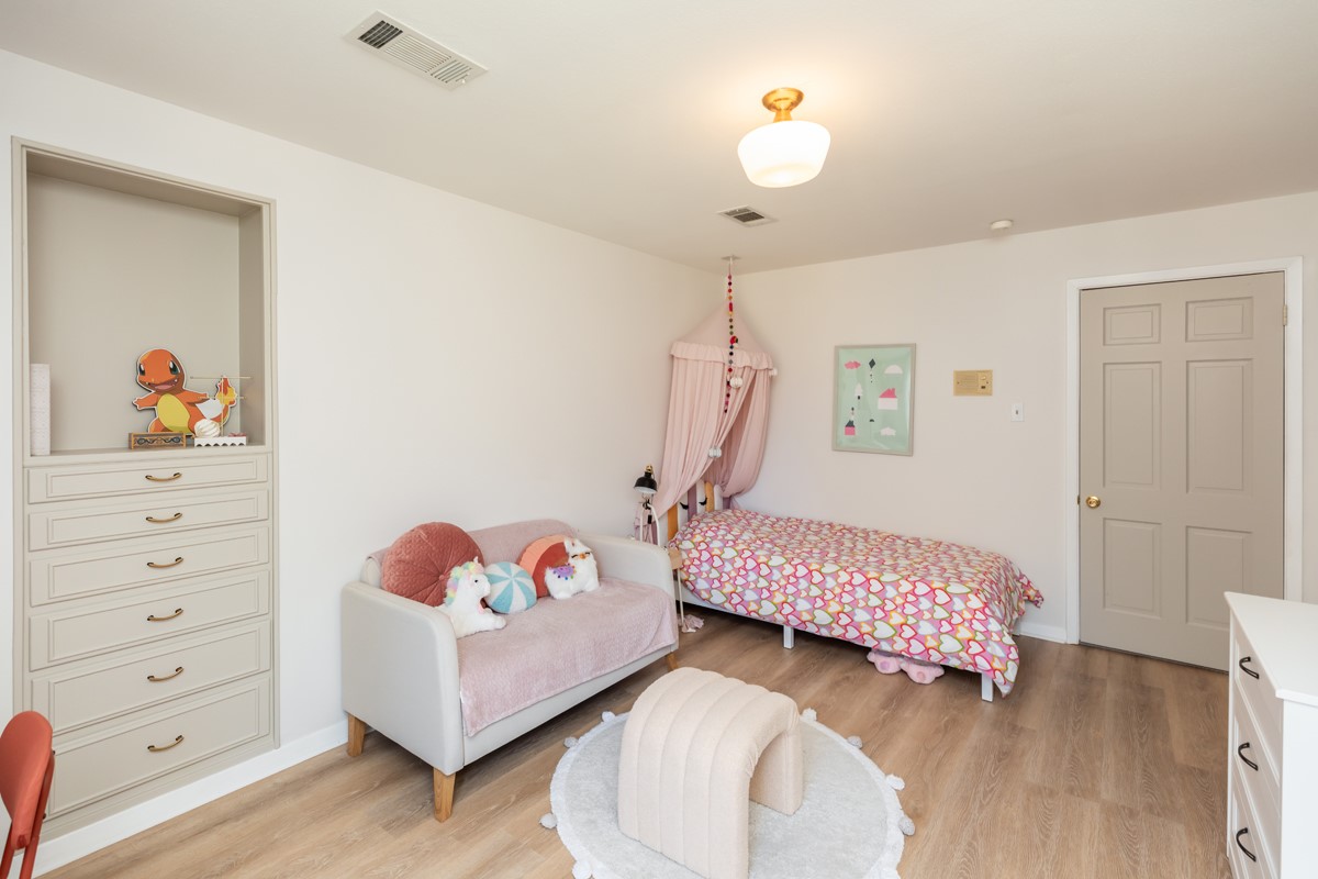 1210 Nottingham Lane Beaumont, TX 77706 - Photo 41 of 50 a bedroom with furniture and a wooden floor