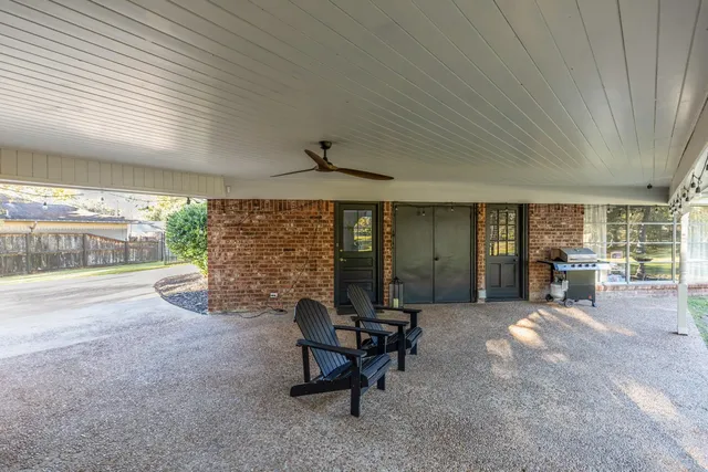 a view of yard with swimming pool and sitting area