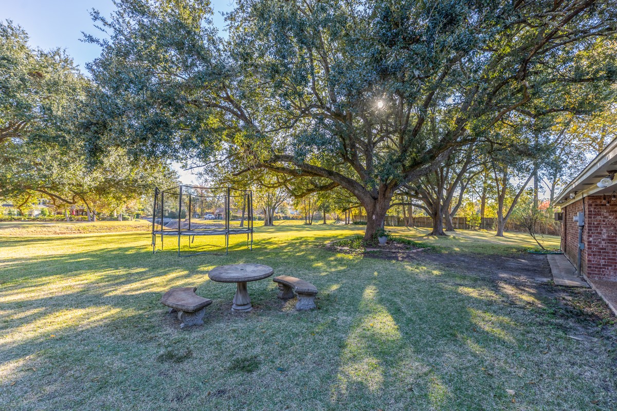 1210 Nottingham Lane Beaumont, TX 77706 - Photo 45 of 50 a view of yard with swimming pool and sitting area