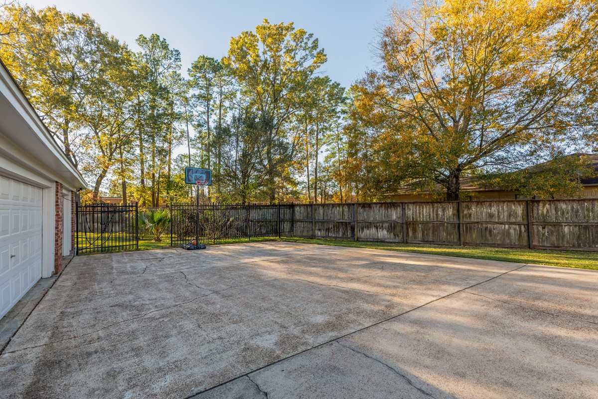 1210 Nottingham Lane Beaumont, TX 77706 - Photo 50 of 50 a view of outdoor space with deck and trees