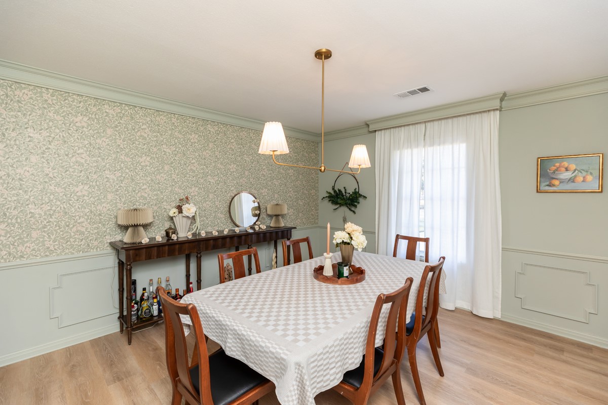 1210 Nottingham Lane Beaumont, TX 77706 - Photo 5 of 50 a view of a dining room with furniture and wooden floor