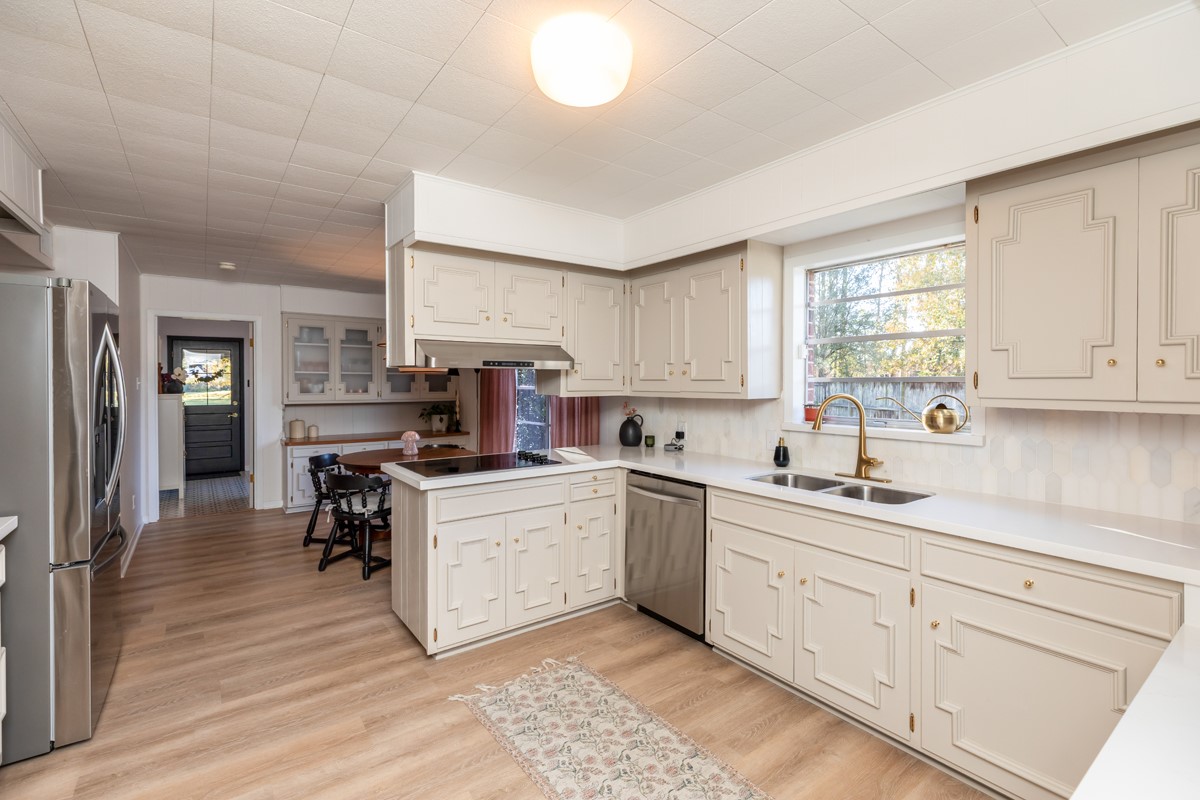 1210 Nottingham Lane Beaumont, TX 77706 - Photo 6 of 50 a kitchen with white cabinets and appliances