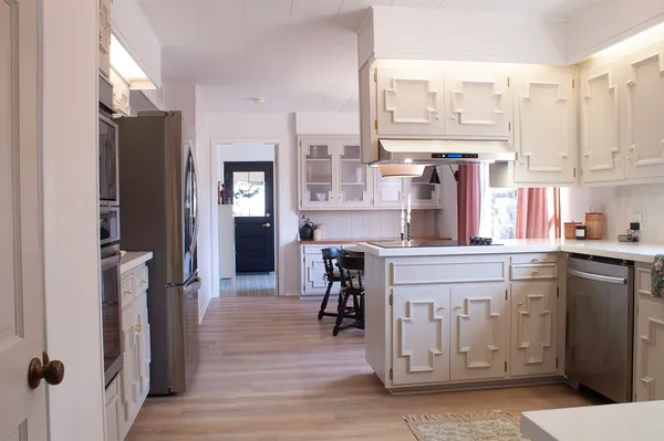 a kitchen with a refrigerator and countertop