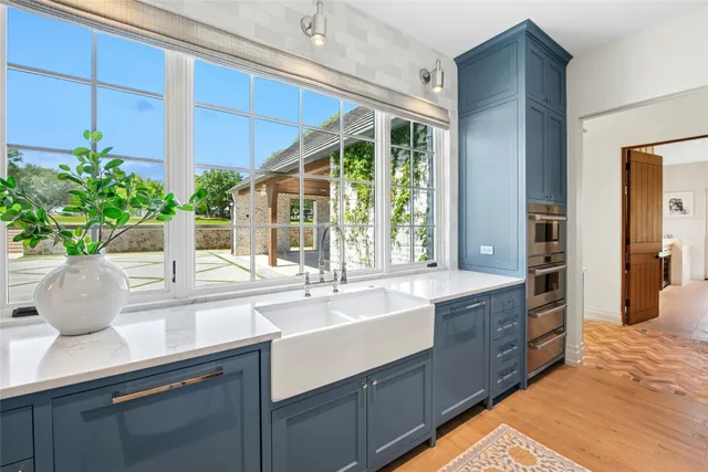 a kitchen with sink and window