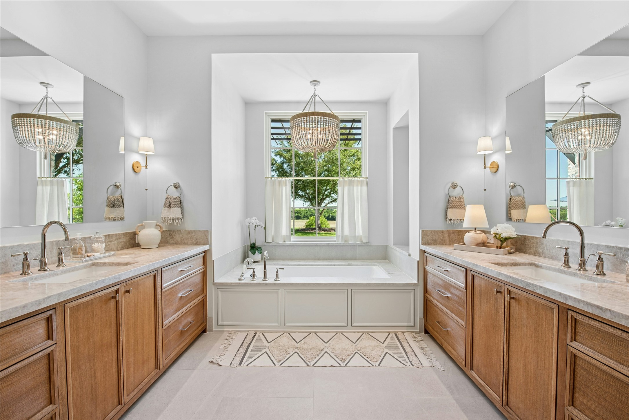 658 Fordtran Road New Ulm, TX 78950 - Photo 18 of 50 a spacious bathroom with a tub sink and mirror