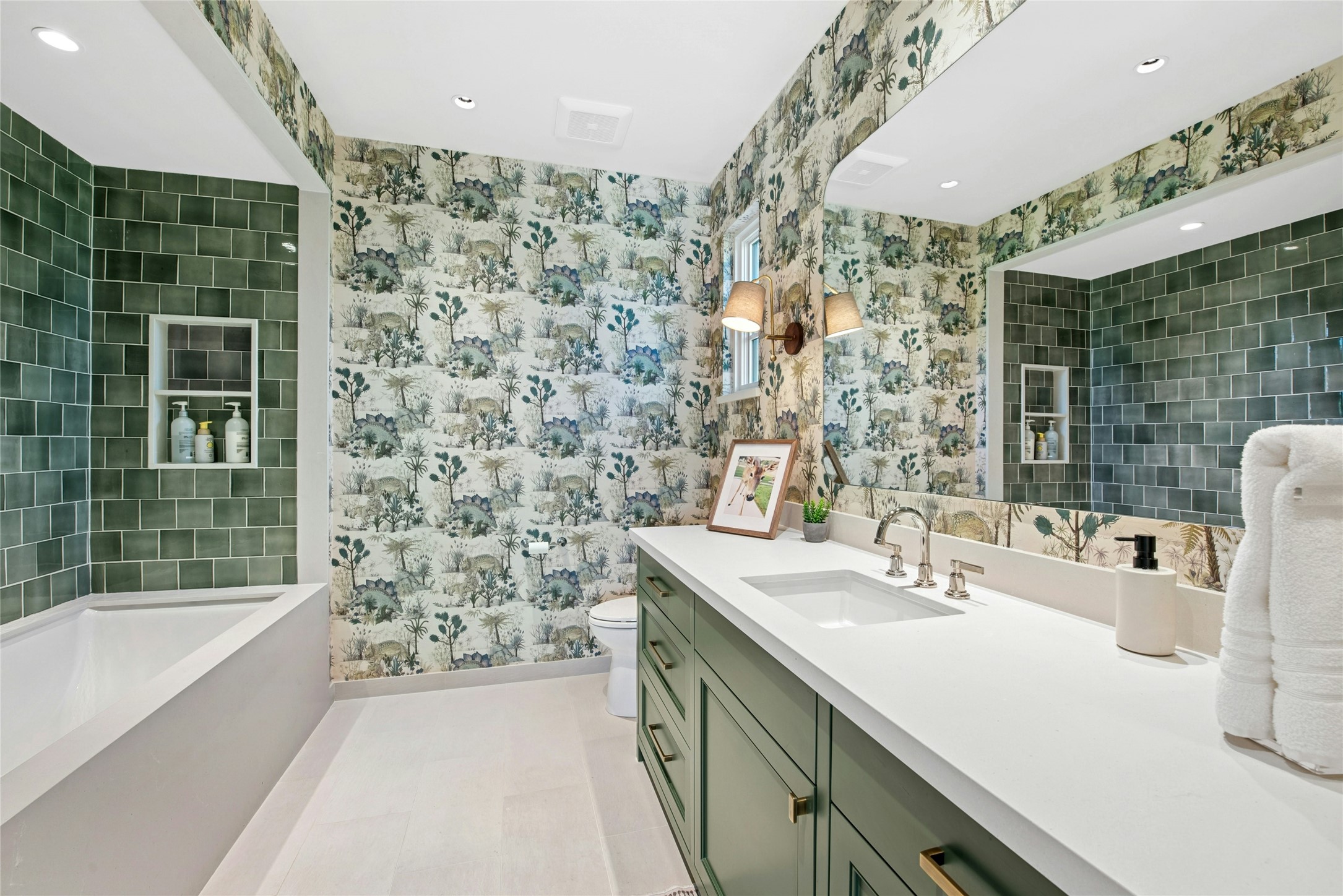 658 Fordtran Road New Ulm, TX 78950 - Photo 25 of 50 a bathroom with a double vanity sink a mirror and a bathtub