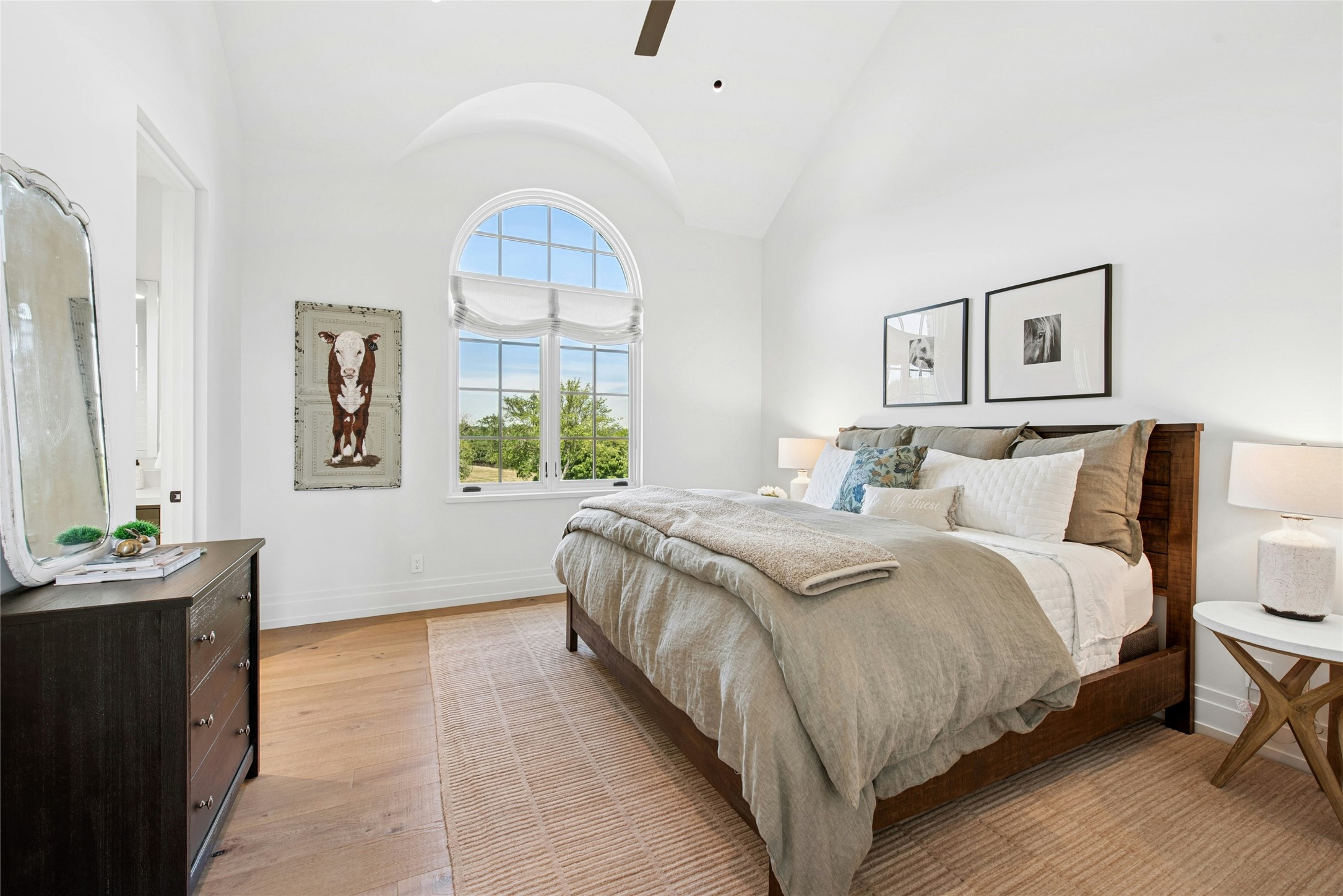 658 Fordtran Road New Ulm, TX 78950 - Photo 29 of 50 a spacious bedroom with a bed and a window
