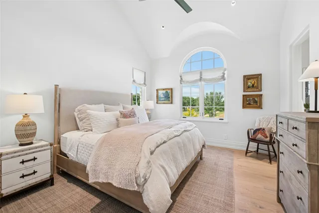 a bedroom with a bed and a chair