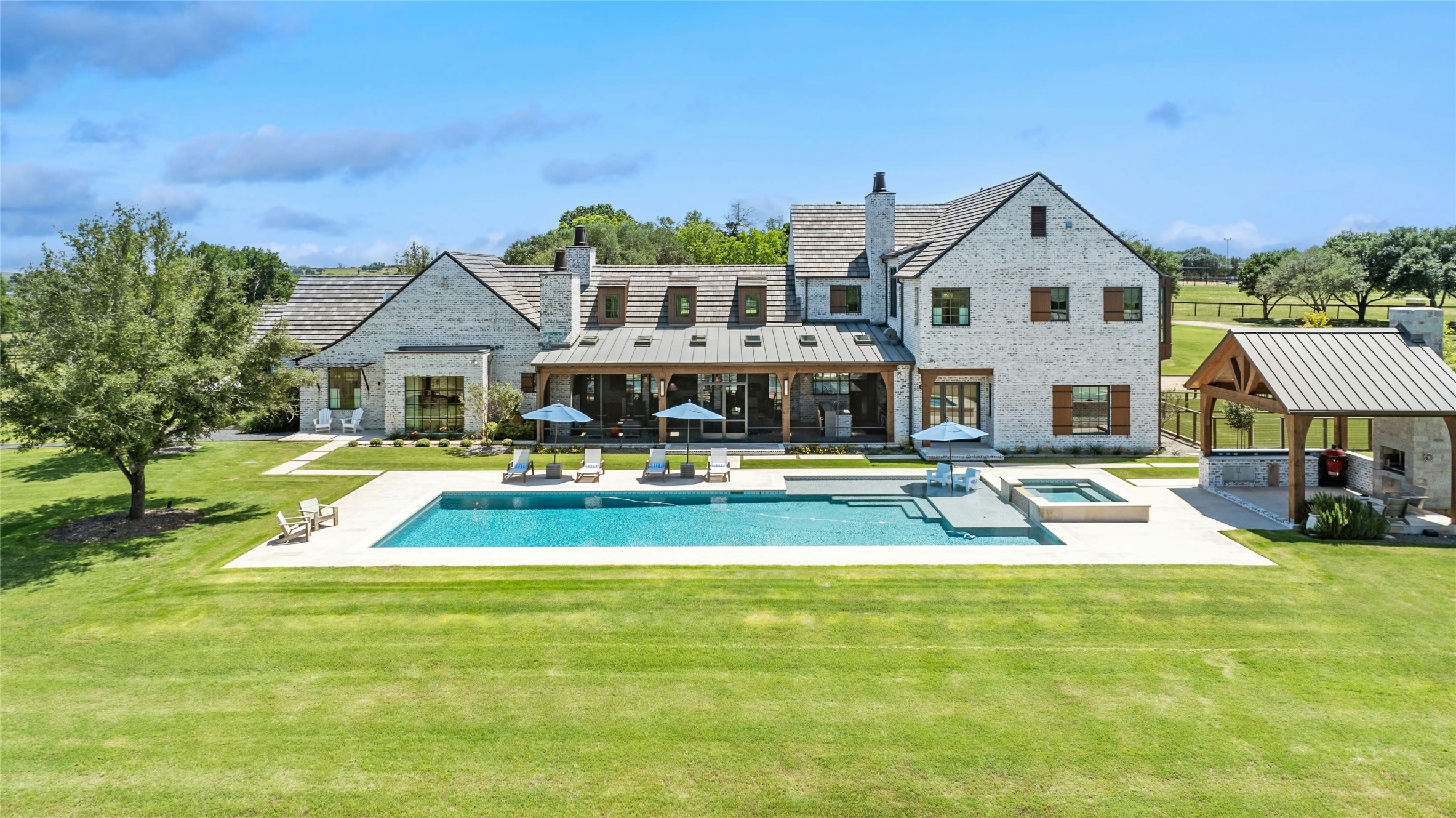 658 Fordtran Road New Ulm, TX 78950 - Photo 4 of 50 a view of a house with swimming pool and porch