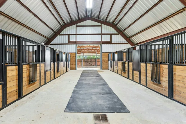 an aerial view of a house with swimming pool garden and mountain view
