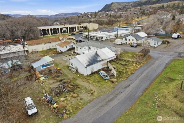 an aerial view of a residential houses with outdoor space