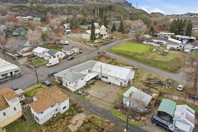 an aerial view of residential houses with outdoor space