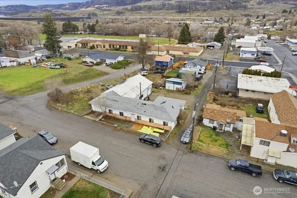 an aerial view of a house with a yard