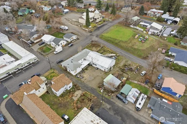 an aerial view of residential houses with outdoor space