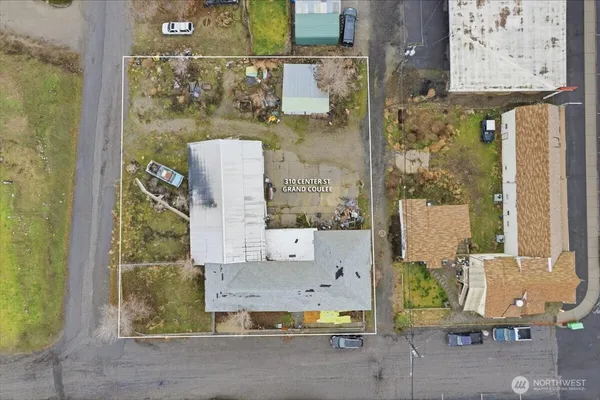 an aerial view of a house with a ocean view