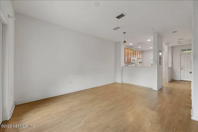 a view of an empty room with a window