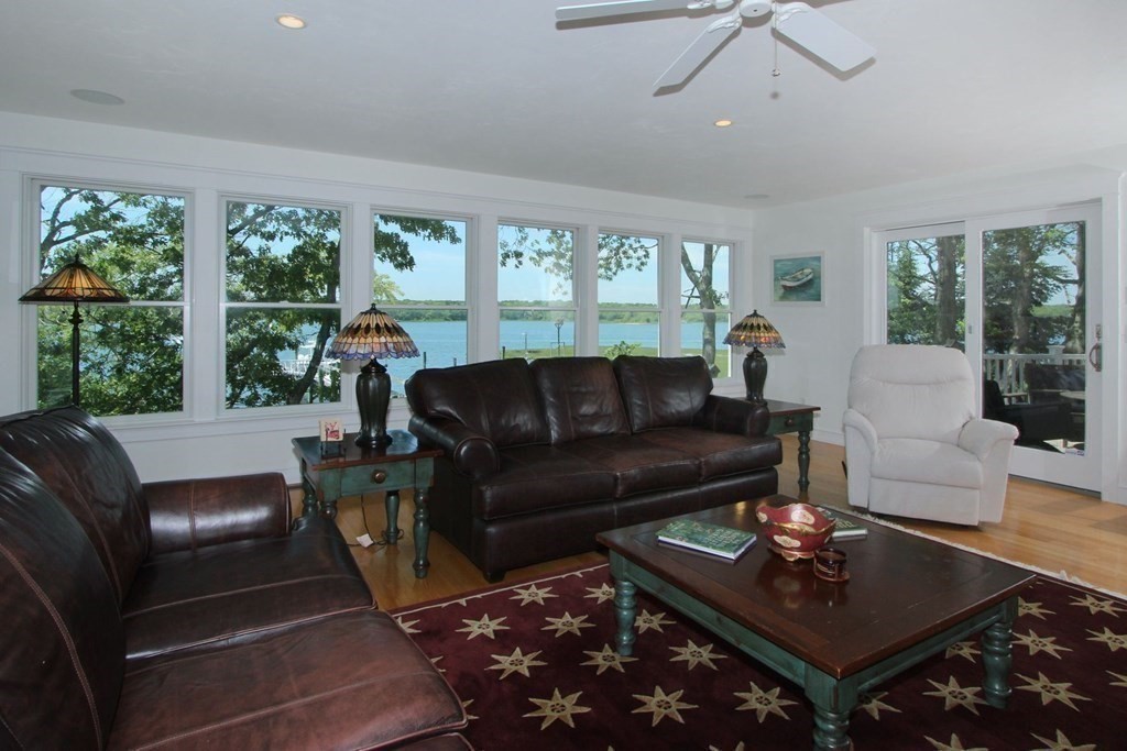 99 Monomoscoy Road West Mashpee, MA 02649 - Photo 32 of 40 a living room with furniture and a large window