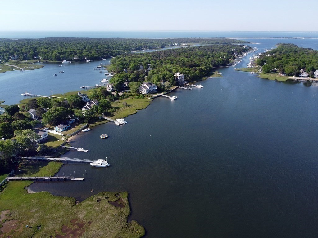 99 Monomoscoy Road West Mashpee, MA 02649 - Photo 33 of 40 an aerial view of a house with a garden