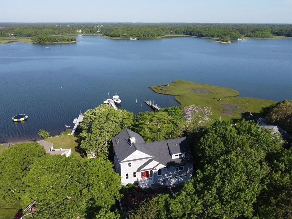 99 Monomoscoy Road West Mashpee, MA 02649 - Photo 34 of 40 an aerial view of a house with a lake view