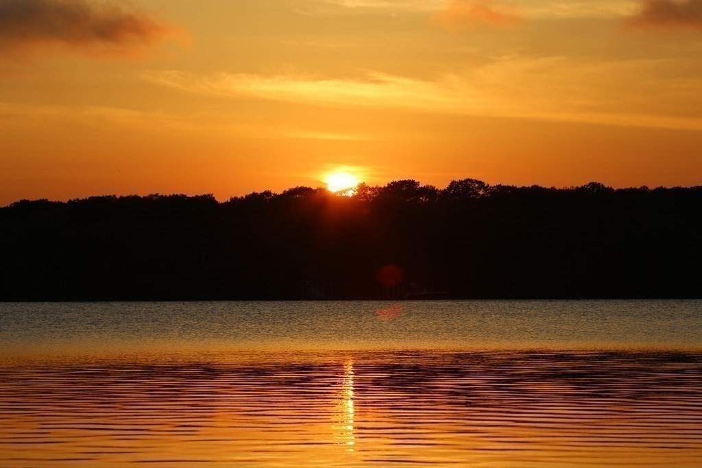 99 Monomoscoy Road West Mashpee, MA 02649 - Photo 8 of 40 a view of an ocean and mountains