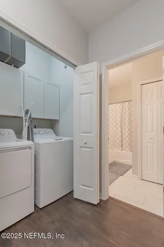 a view of hallway with wooden floor