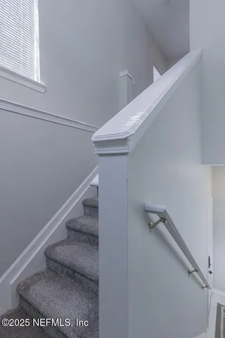 a view of a chair and tables in the patio