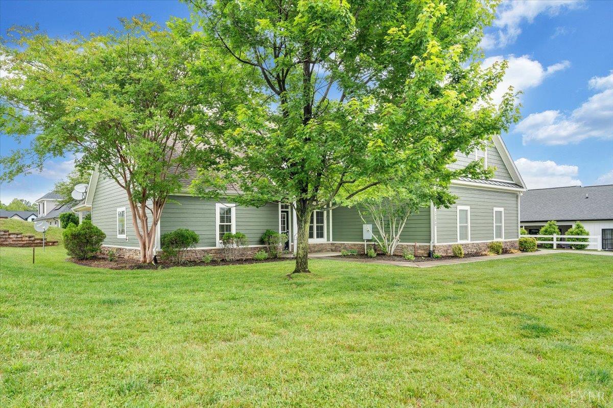1250 Our Cove Road Huddleston, VA 24104 - Photo 51 of 70 a view of a house with a big yard and large trees