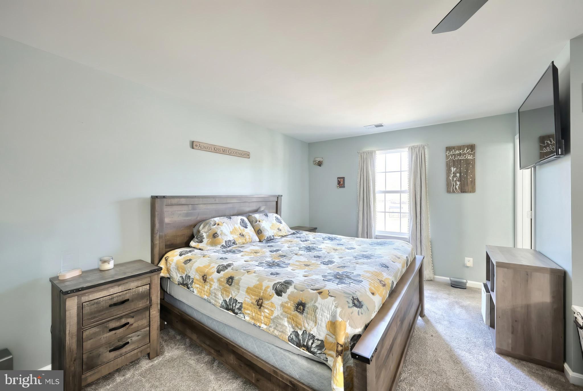 712 Spencer Drive Hanover, PA 17331 - Photo 18 of 23 a bedroom with a bed and a flat screen tv