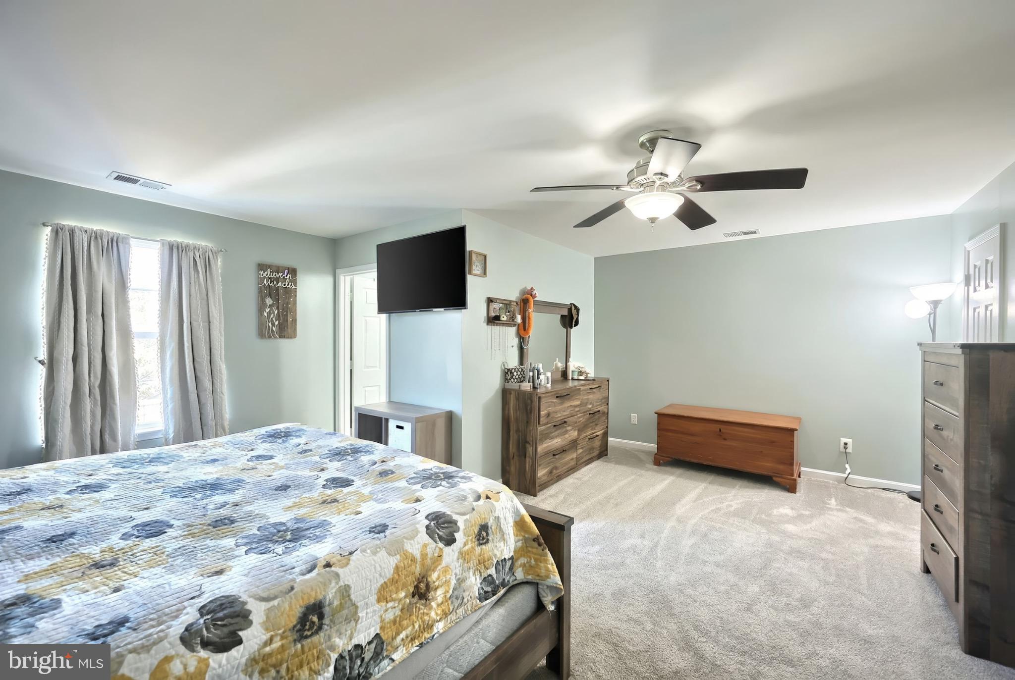 712 Spencer Drive Hanover, PA 17331 - Photo 19 of 23 a bedroom with a bed and a chandelier