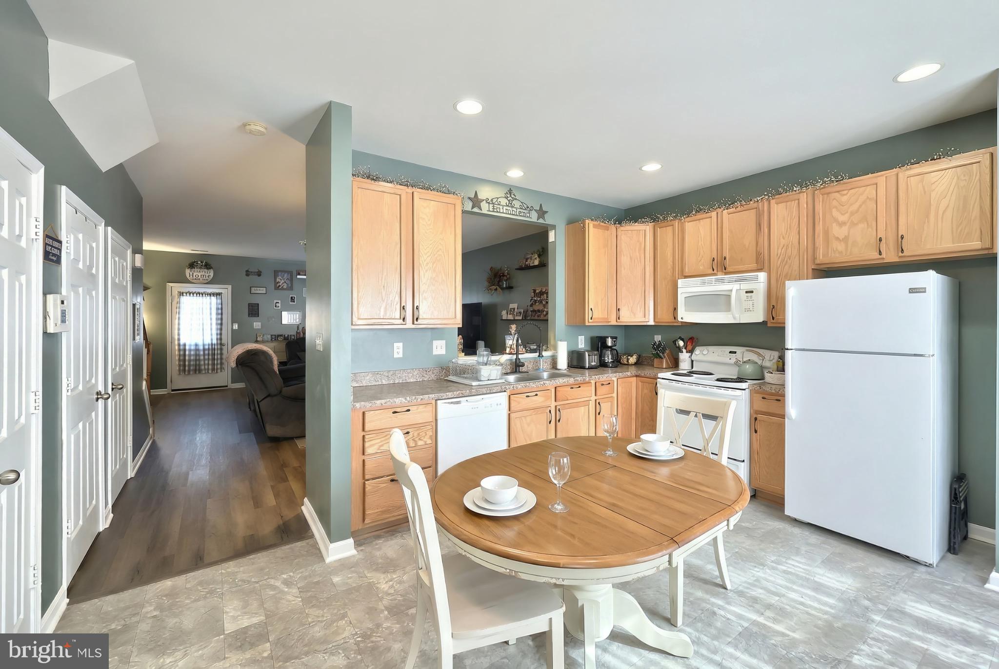 712 Spencer Drive Hanover, PA 17331 - Photo 8 of 23 a large kitchen with kitchen island a large counter top space a sink stainless steel appliances and cabinets