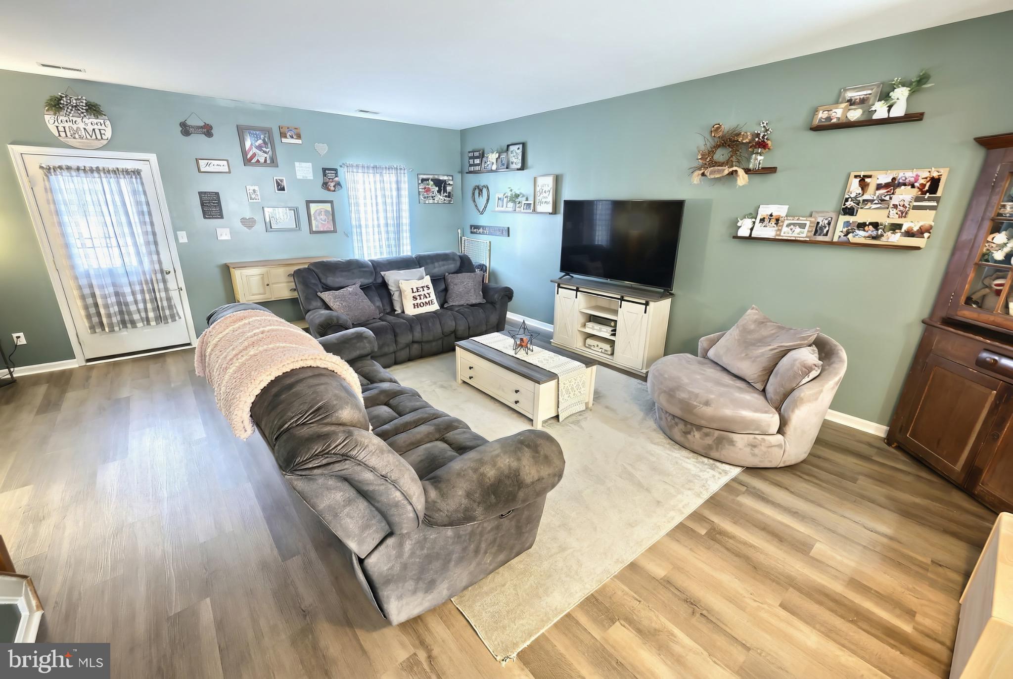 712 Spencer Drive Hanover, PA 17331 - Photo 10 of 23 a living room with furniture or couch and a flat screen tv