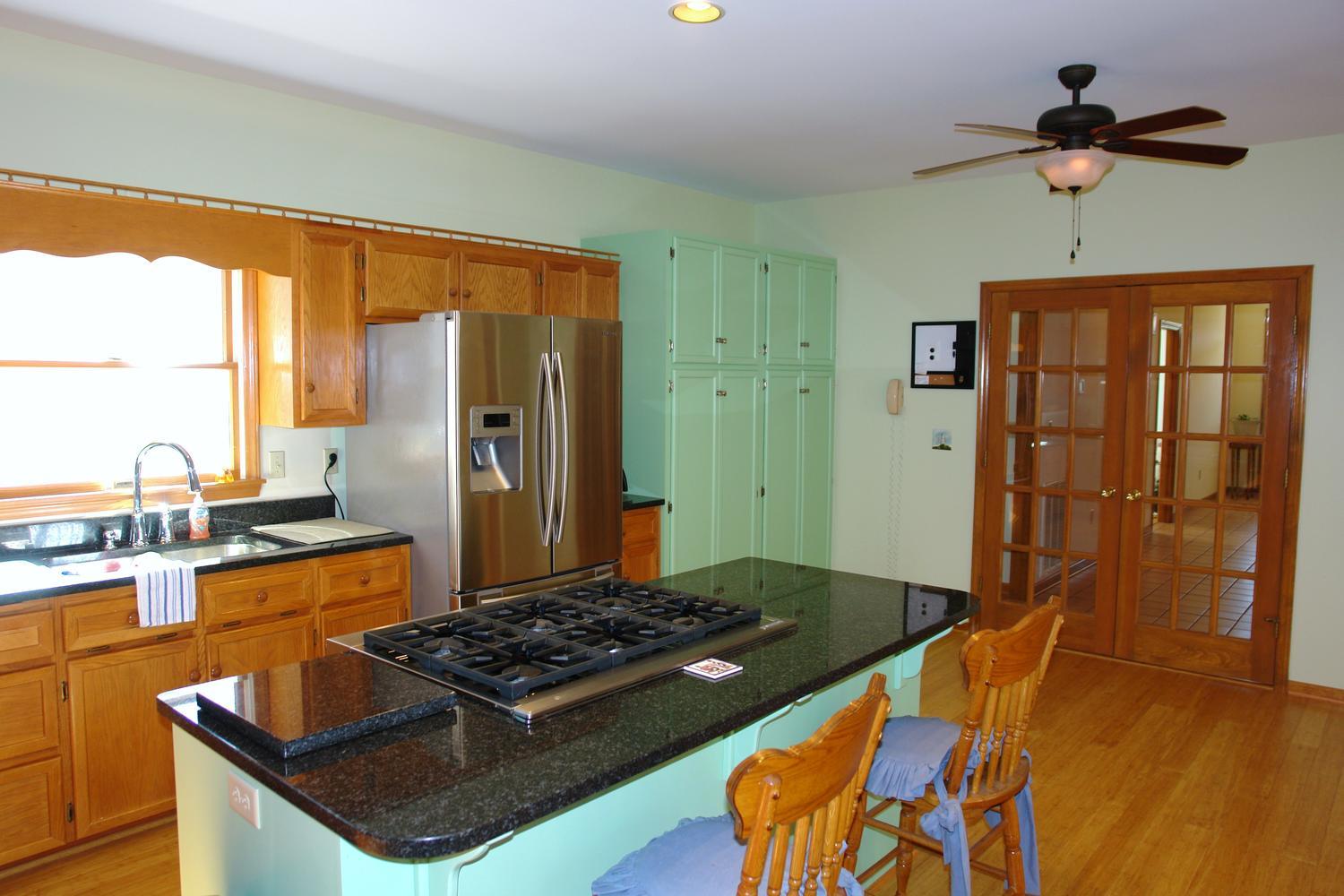 468 Liberty Road Penhook, VA 24137 - Photo 16 of 54 a kitchen with stainless steel appliances granite countertop a stove and a refrigerator