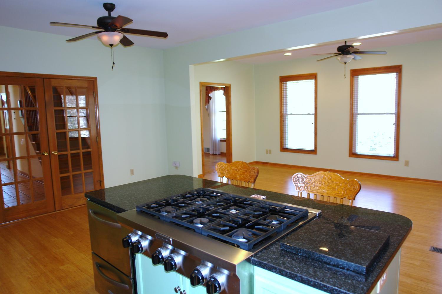 468 Liberty Road Penhook, VA 24137 - Photo 17 of 54 a room with wooden floor and a window