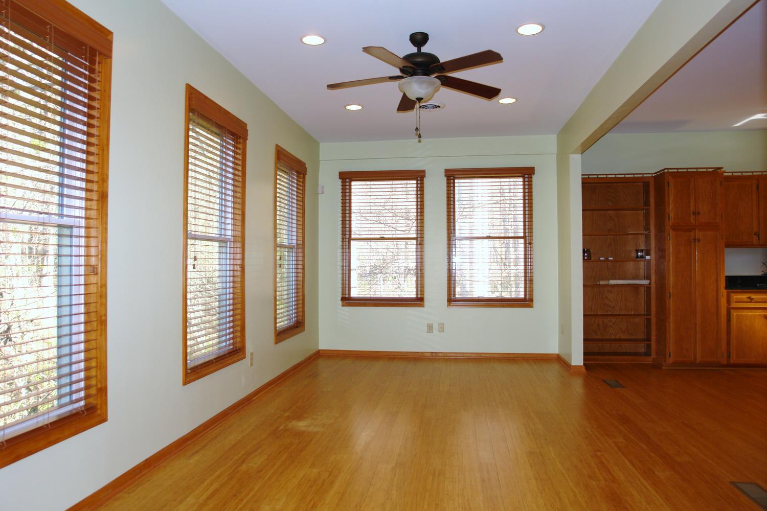 468 Liberty Road Penhook, VA 24137 - Photo 19 of 54 a view of an empty room with a window and wooden floor