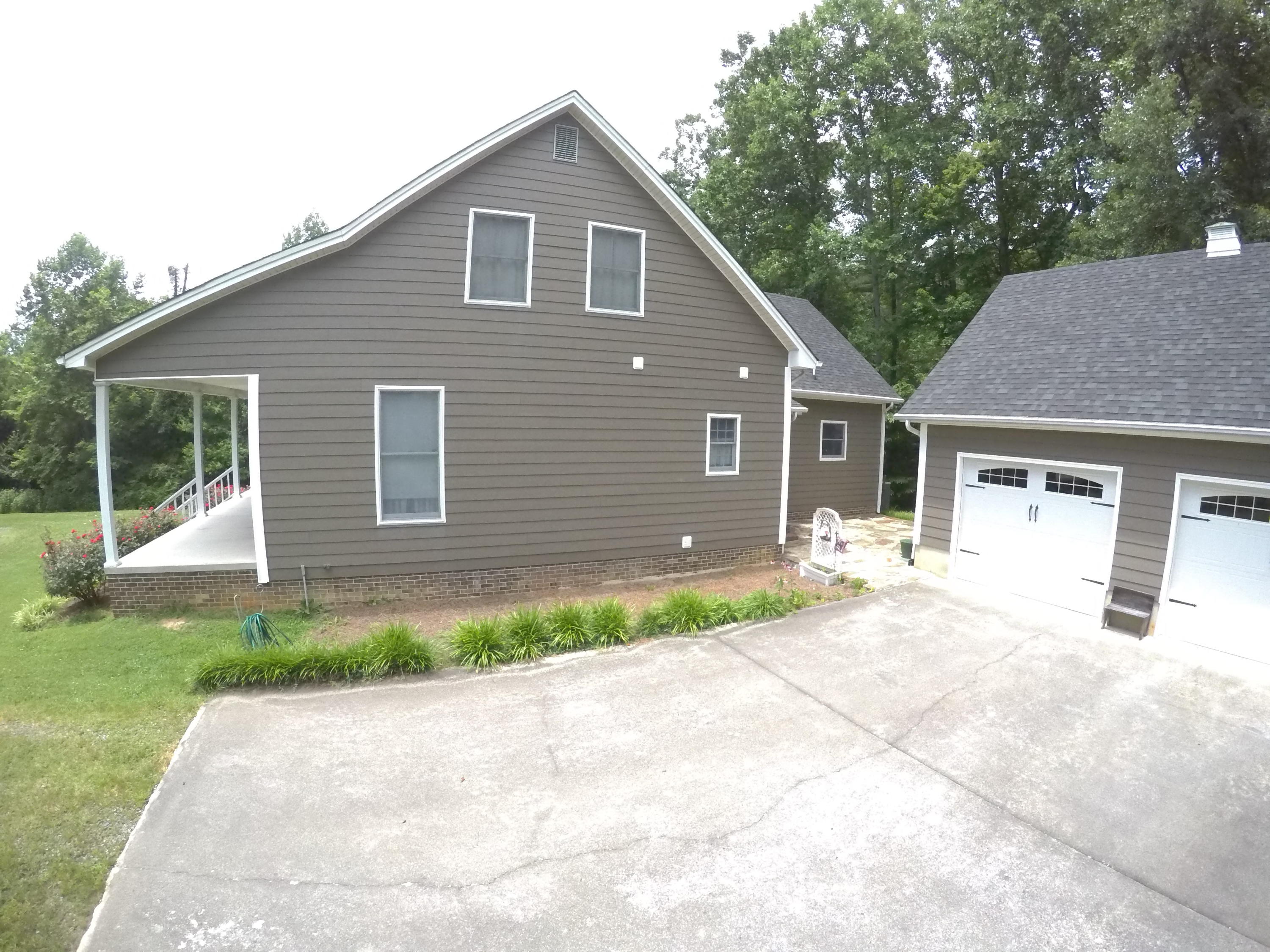 468 Liberty Road Penhook, VA 24137 - Photo 3 of 54 a front view of a house with a yard and garage