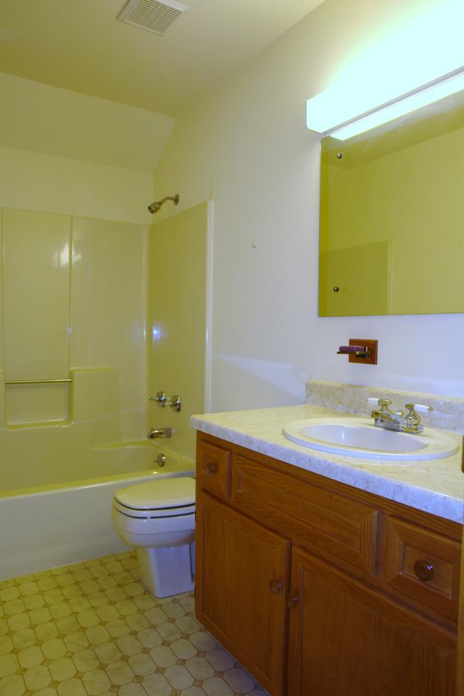 468 Liberty Road Penhook, VA 24137 - Photo 28 of 54 a bathroom with a granite countertop sink toilet and mirror