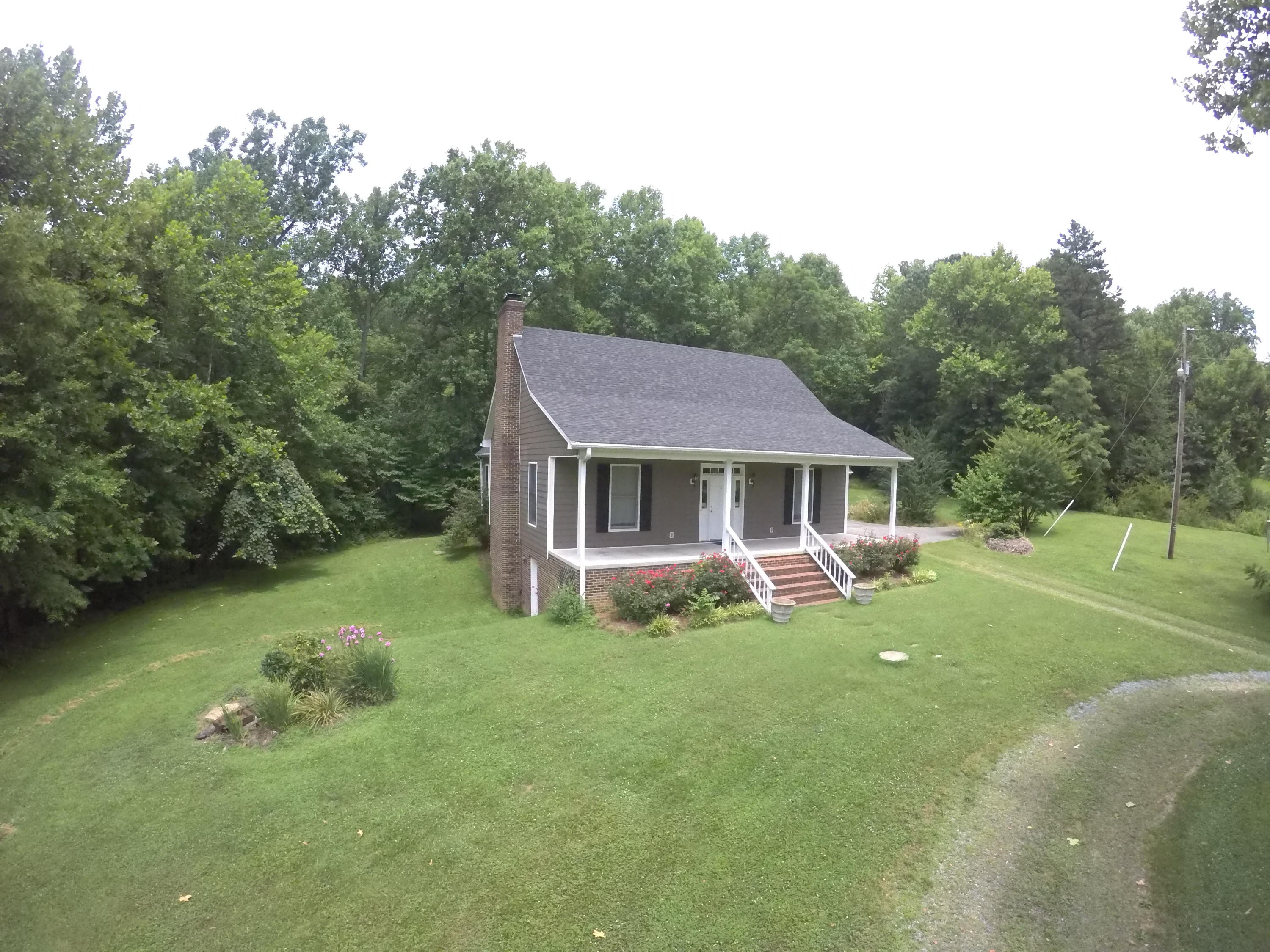 468 Liberty Road Penhook, VA 24137 - Photo 4 of 54 a front view of a house with garden