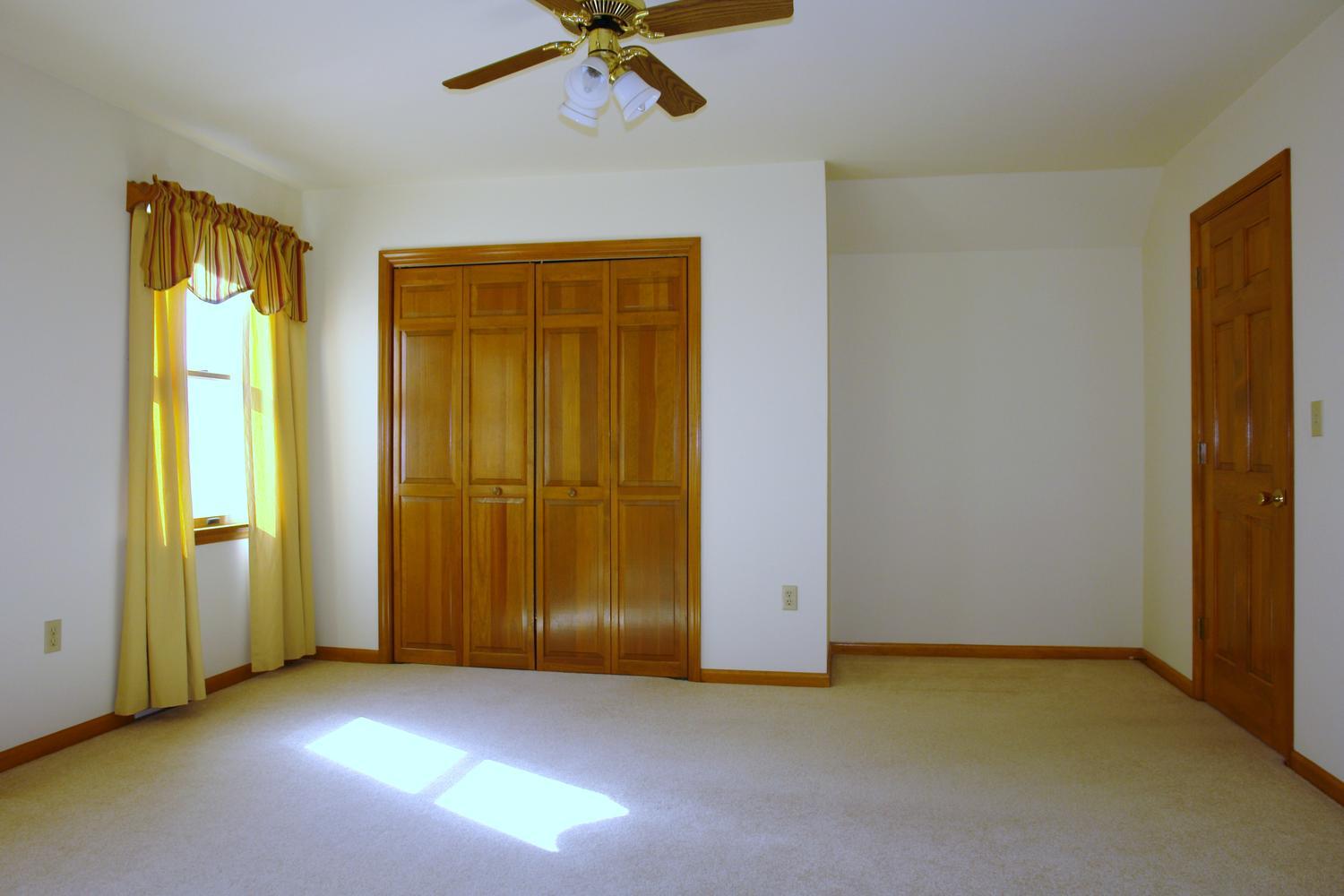 468 Liberty Road Penhook, VA 24137 - Photo 31 of 54 an empty room with windows and closet area