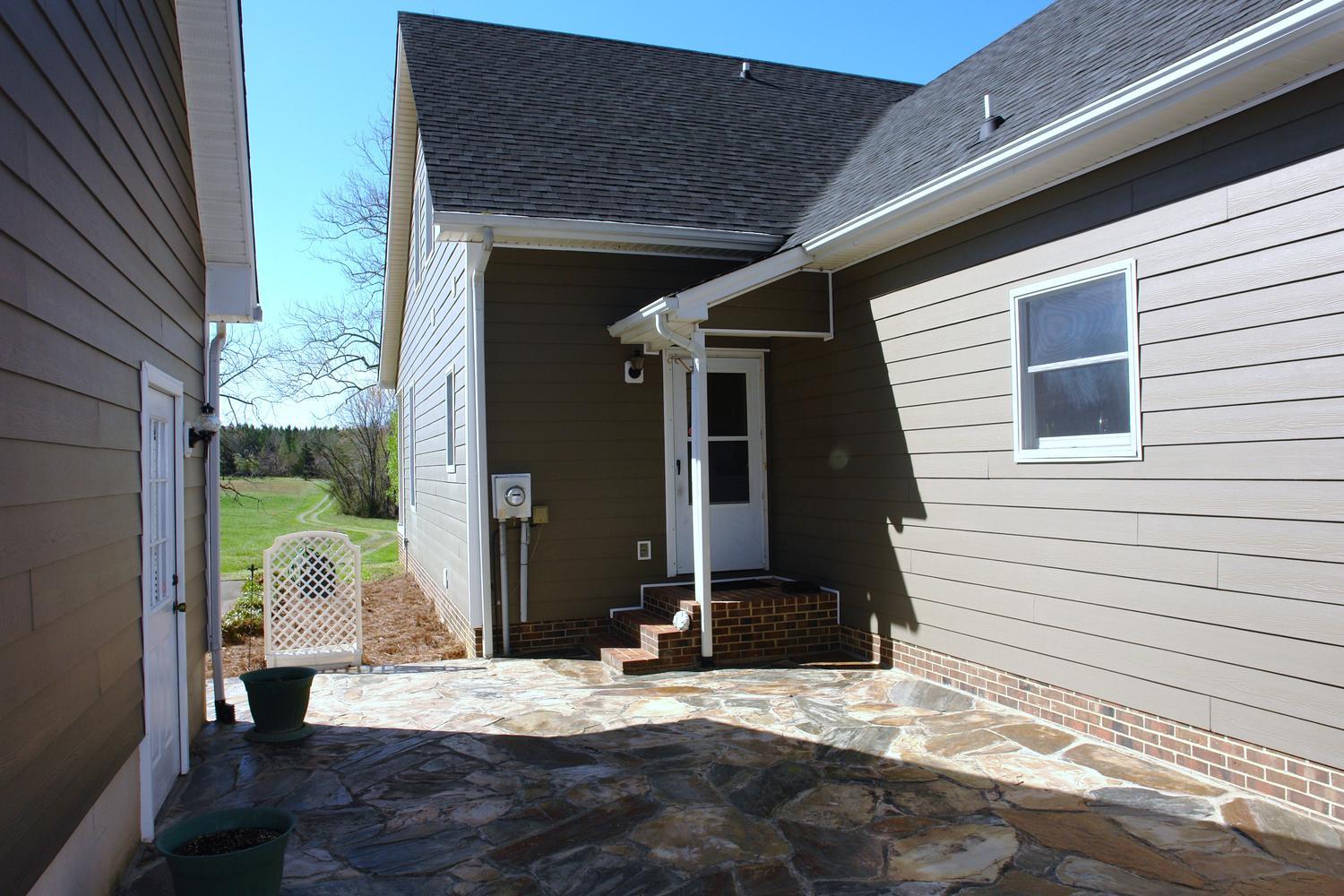 468 Liberty Road Penhook, VA 24137 - Photo 36 of 54 a front view of a house with garden