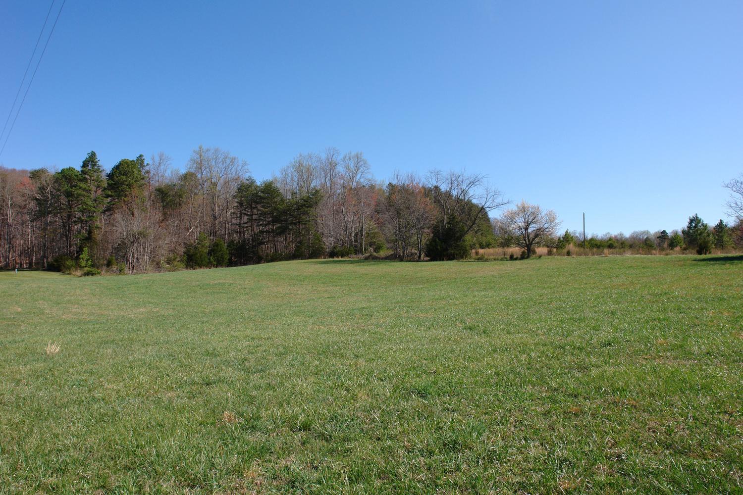 468 Liberty Road Penhook, VA 24137 - Photo 40 of 54 a view of a field with trees in background