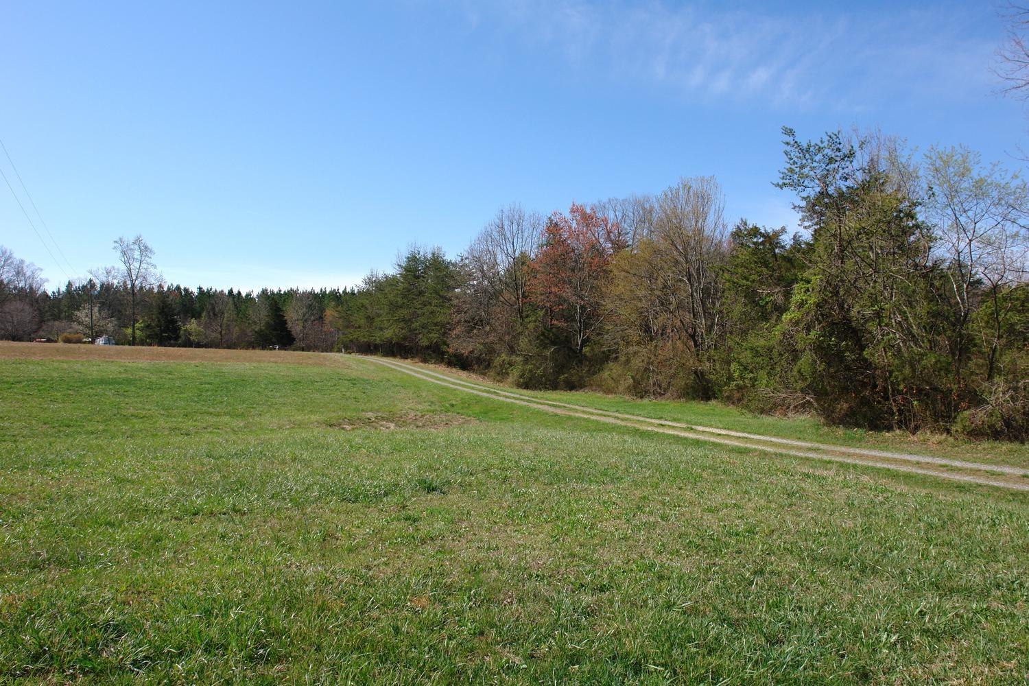468 Liberty Road Penhook, VA 24137 - Photo 41 of 54 a view of a field with trees in the background