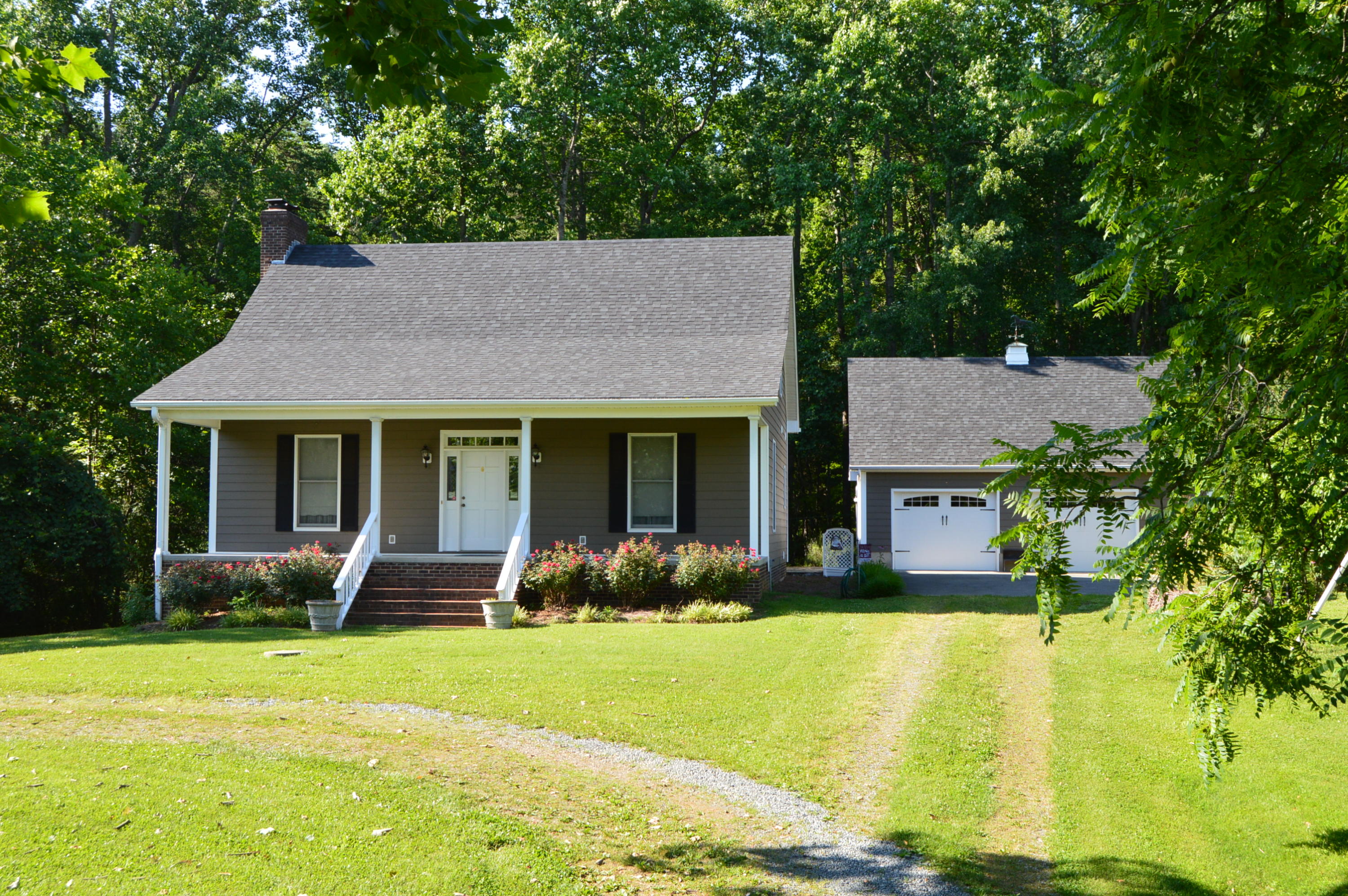 468 Liberty Road Penhook, VA 24137 - Photo 8 of 54 a front view of a house with garden