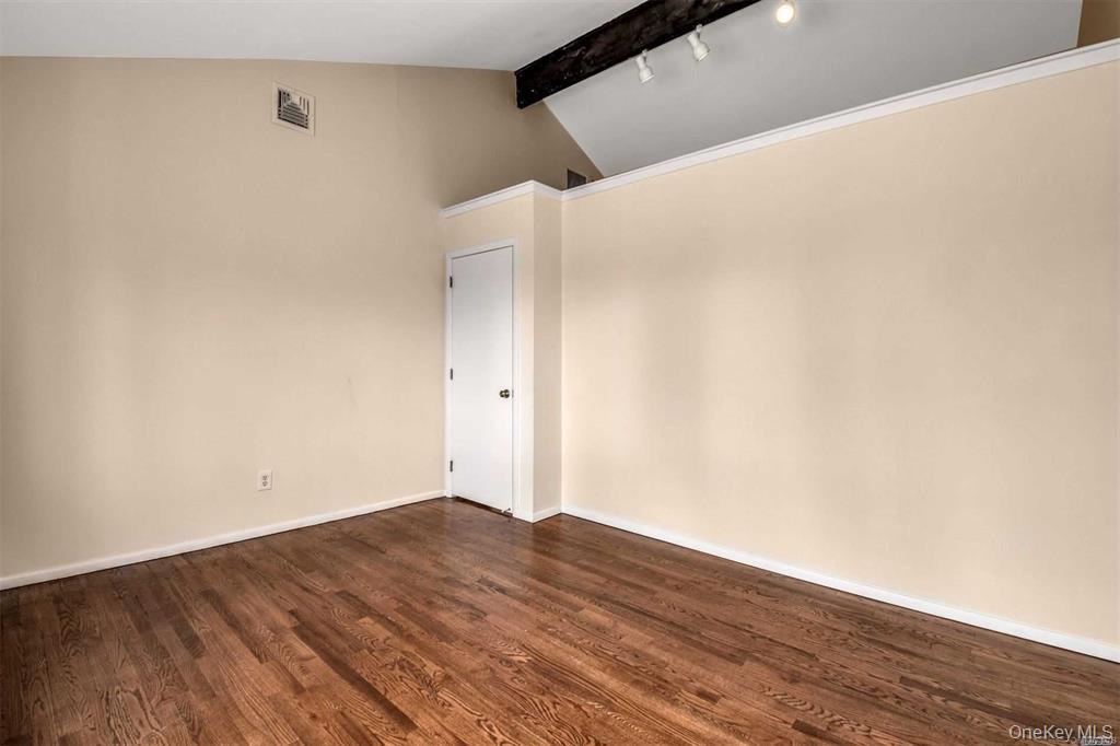36 Bevin Road Northport, NY 11768 - Photo 18 of 26 Spare room featuring dark wood-type flooring and baseboards