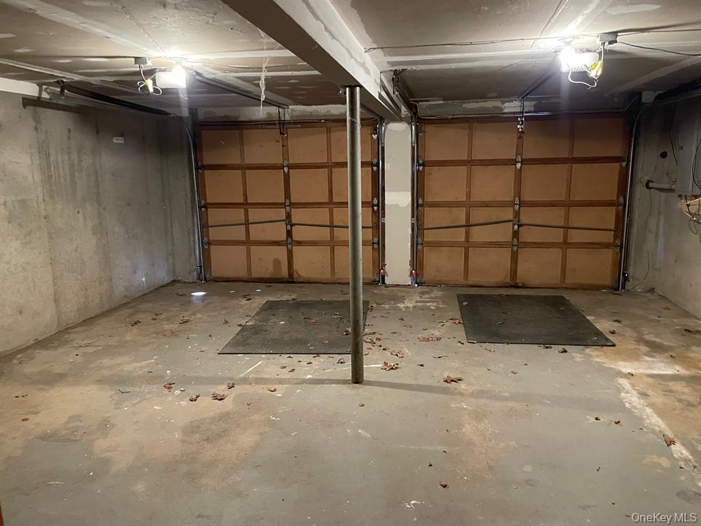 36 Bevin Road Northport, NY 11768 - Photo 23 of 26 Garage featuring a garage door opener